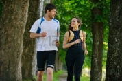 15037138-young-couple-jogging-in-park-at-morning-health-and-fitness