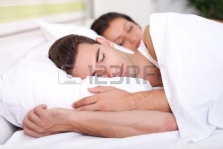 15074964-man-and-woman-sleeping